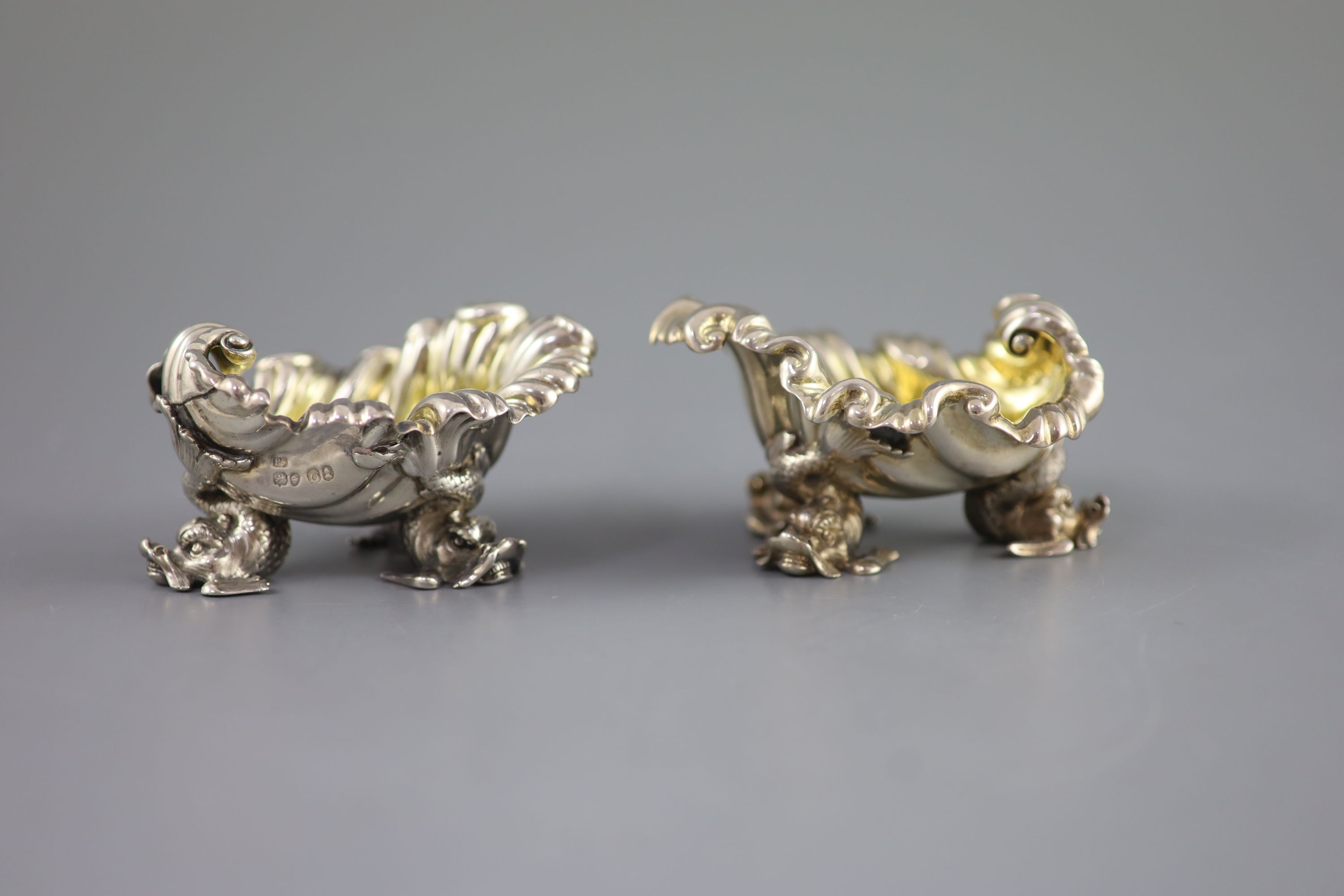 A pair of George IV silver shell shaped salts, by Paul Storr